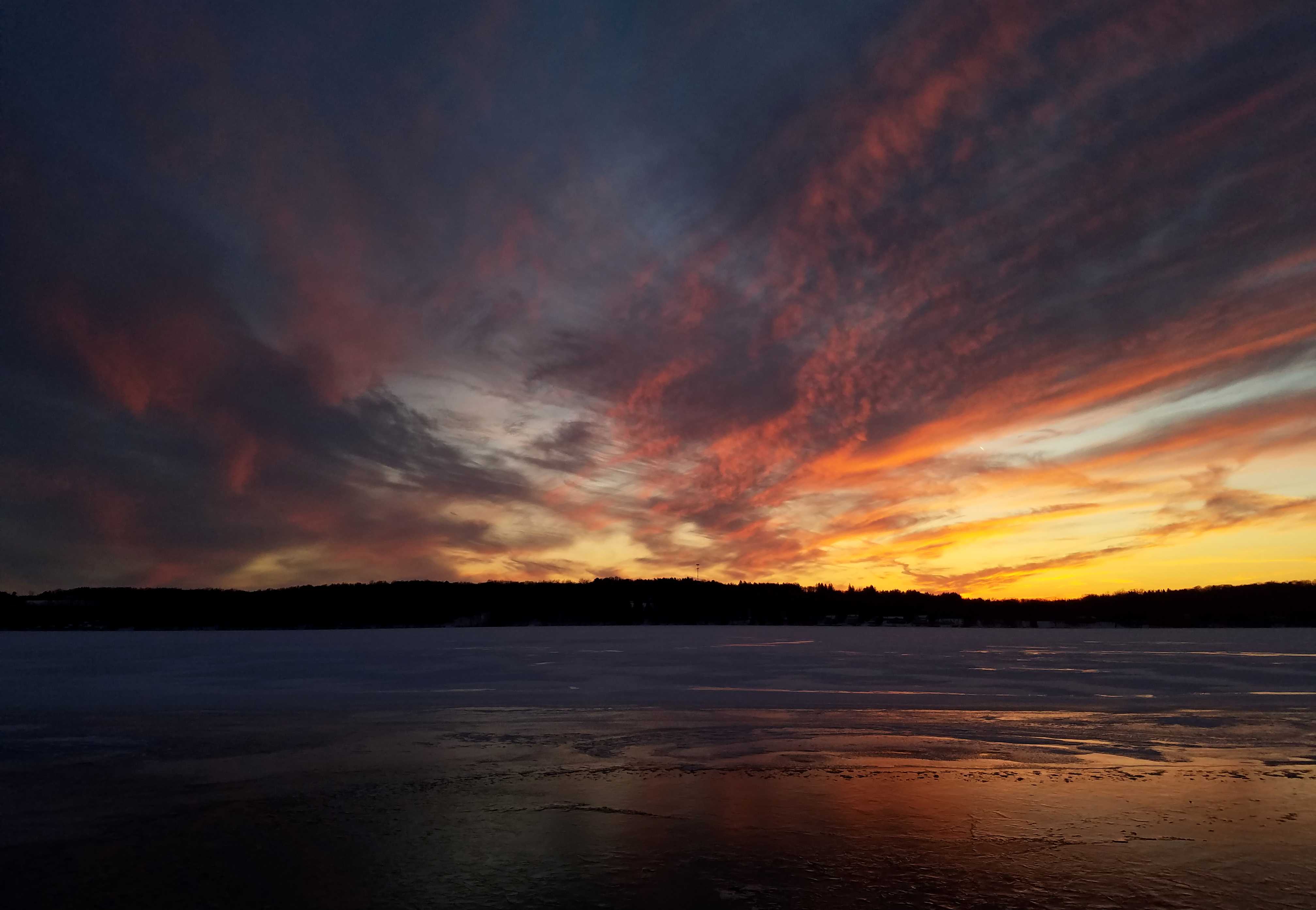 Sunset over a frozen Cazenovia Lake